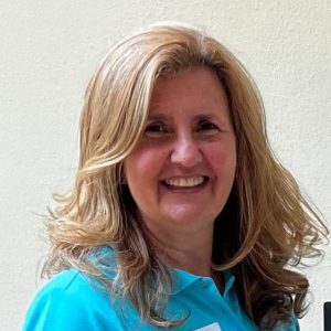 Nathalie Asmar with FitAccounts turquoise polo top
